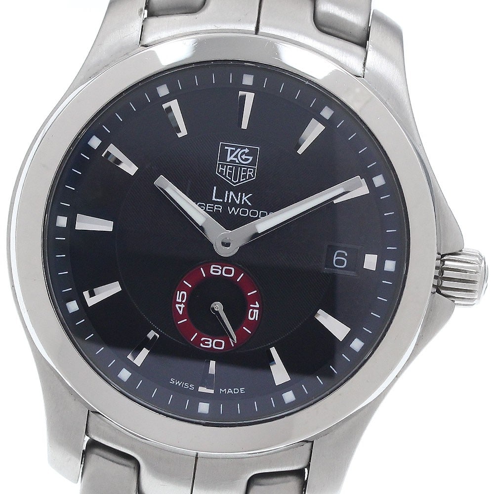 TAG Heuer Link Tiger Woods Automatic Date Watch WJ2110: TAG Heuer Link Tiger Woods Automatic Date Watch WJ2110 This TAG Heuer Link Tiger Woods Small Seconds men's wristwatch features a stainless steel case and bracelet with a black dial. The watch is power