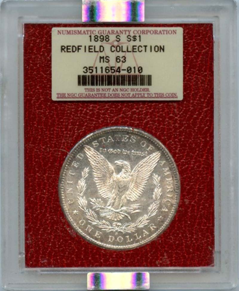 1898-S Morgan Dollar NGC MS63 Redfield Hoard Uncirculated: 1898-S Morgan Dollar NGC MS63 Redfield Hoard Uncirculated This stunning 1898-S Morgan Dollar is part of the Redfield Hoard and has been graded MS63 by NGC, ensuring its high quality and preservation. 
