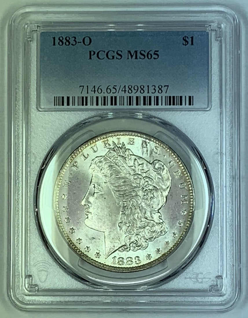 1883-O Morgan Dollar Silver Coin PCGS MS 65 Certified: 1883-O Morgan Dollar Silver Coin PCGS MS 65 Certified This is an 1883-O Morgan Silver Dollar graded MS 65 by PCGS. The coin is uncirculated and features the Morgan design. It is composed of silver and