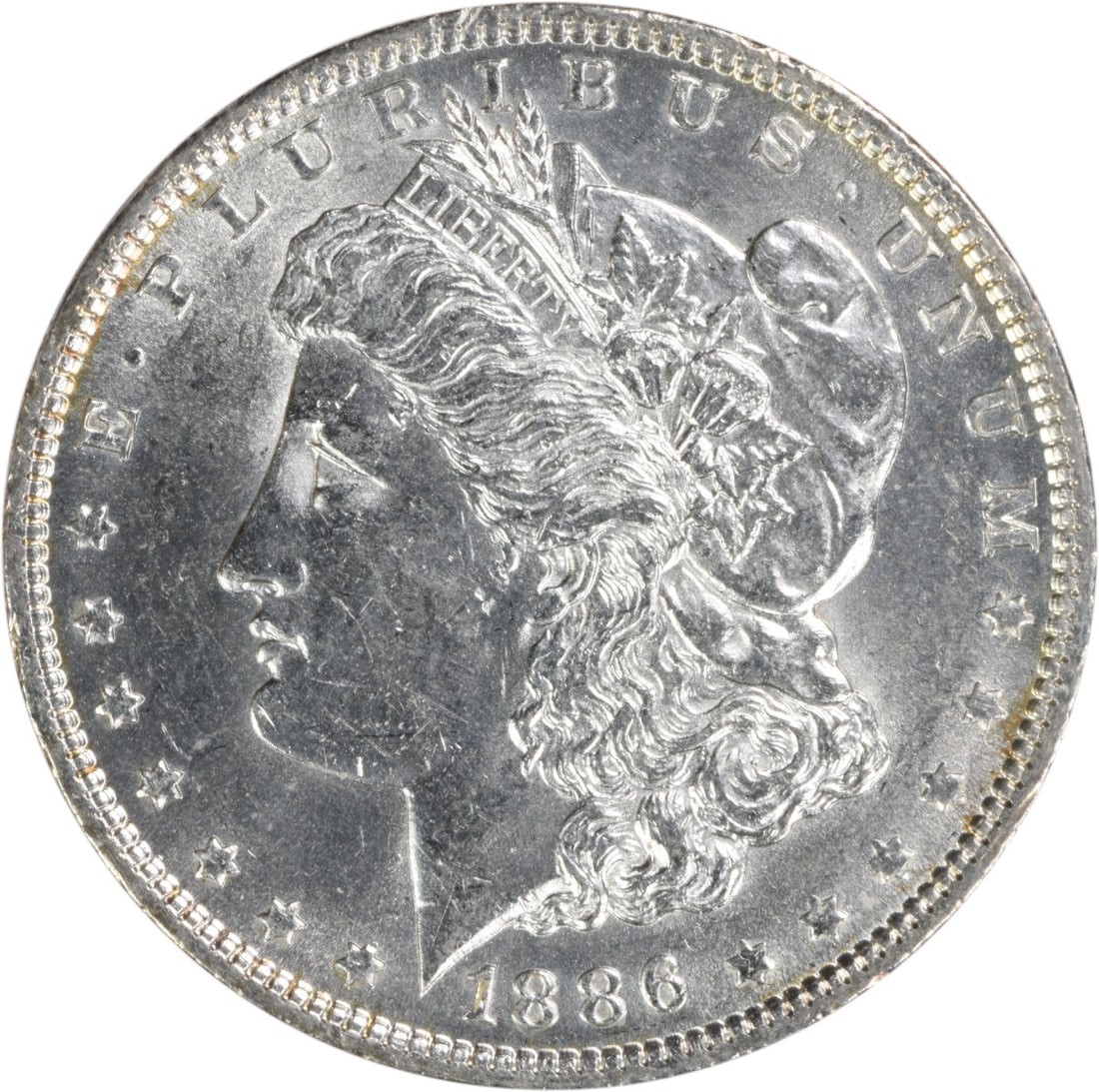 1886 Silver Morgan Dollar Brilliant Uncirculated Uncertified Coin: 1886 Silver Morgan Dollar Brilliant Uncirculated Uncertified Coin This is an 1886 Morgan Silver Dollar from the United States, featuring a Brilliant Uncirculated (BU) grade. Composed of silver and wit