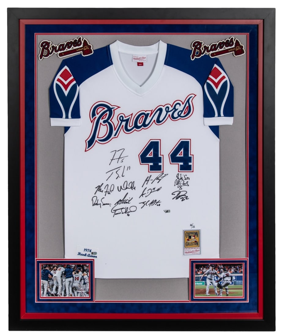 Framed Atlanta Braves 13-Signature Mitchell Ness Hank Aaron 1974 Jersey 11 21: Framed Atlanta Braves 13-Signature Mitchell Ness Hank Aaron 1974 Jersey 11 21 This framed authentic Mitchell & Ness Hank Aaron 1974 model jersey commemorates the 2021 Atlanta Braves World Series Champ