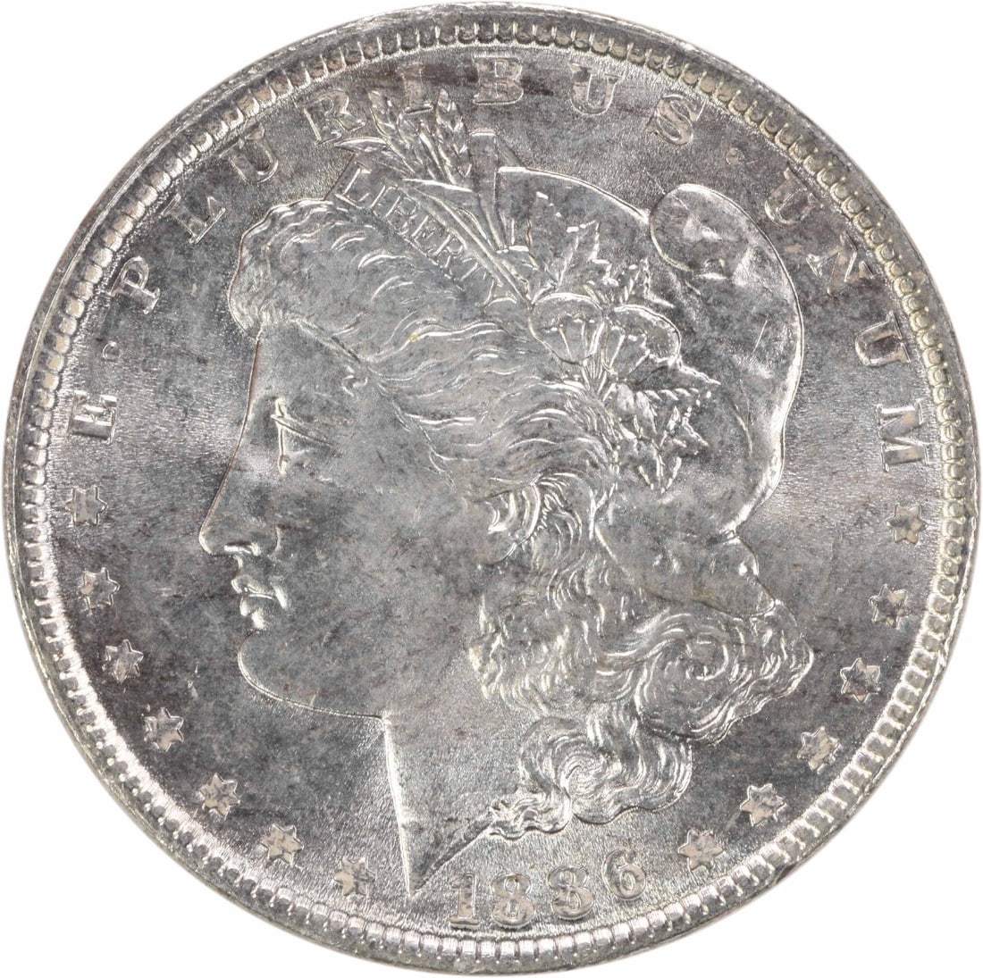 1886 Silver Dollar Morgan Series Brilliant Uncirculated Uncertified: 1886 Silver Dollar Morgan Series Brilliant Uncirculated Uncertified This is an uncirculated 1886 Morgan Silver Dollar from the United States, featuring brilliant uncirculated (BU) quality. The coin is
