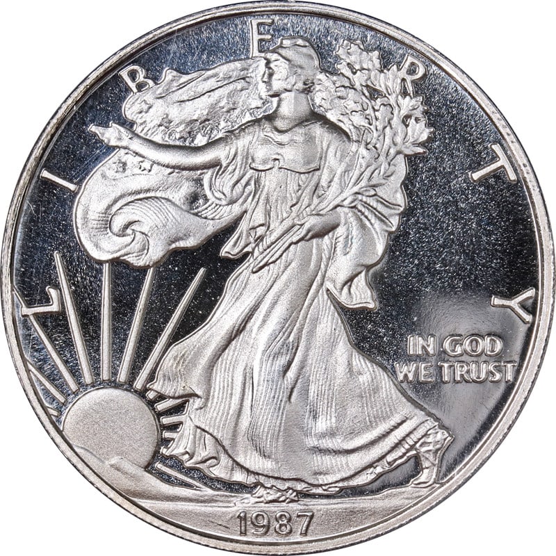 1987 Daniel Carr Silver Eagle Overstrike ANACS PR69 DCAM: 1987 Daniel Carr Silver Eagle Overstrike ANACS PR69 DCAM This is a 1987 DC Daniel Carr Overstruck Proof Silver Eagle Design coin, featuring a strong strike and attractive luster. The coin is composed 