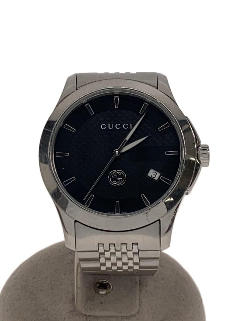 Gucci G-Timeless silver quartz ladies wristwatch 126.4: Gucci G-Timeless silver quartz ladies wristwatch 126.4 This is a pre-owned GUCCI G-TIMELESS Quartz 126.4 women's wristwatch. The watch features a silver-tone case and band, with a Swiss origin. It sho