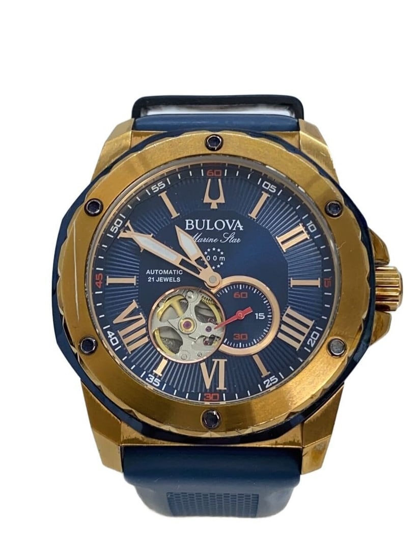 Bulova Navy Rubber Marine Star Wristwatch: Bulova Navy Rubber Marine Star Wristwatch This BULOVA Marine Star 98A227 men's wristwatch features a navy color scheme with a durable rubber band. The watch is pre-owned and shows slight signs of use,