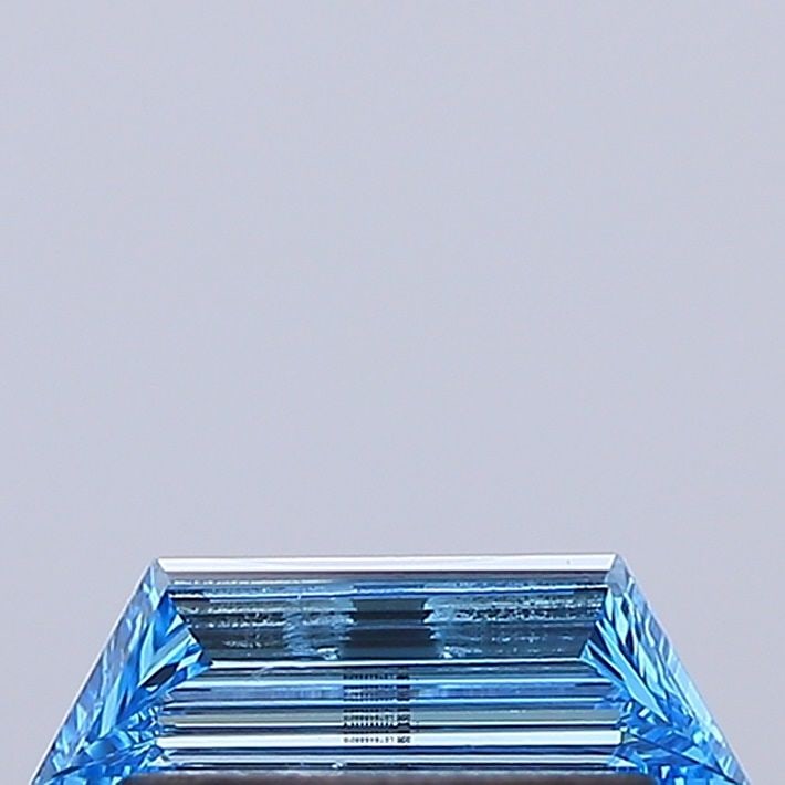 Loose Diamond - TRAPEZOID 0.22ct Fancy Vivid Blue VVS2: Loose Diamond - TRAPEZOID 0.22ct Fancy Vivid Blue VVS2 Source: This is a real non-mined Diamond that has been grown in a lab Shape: TRAPEZOID Carats: 0.22 Color: Fancy Vivid Blue Certification: IGI Vi