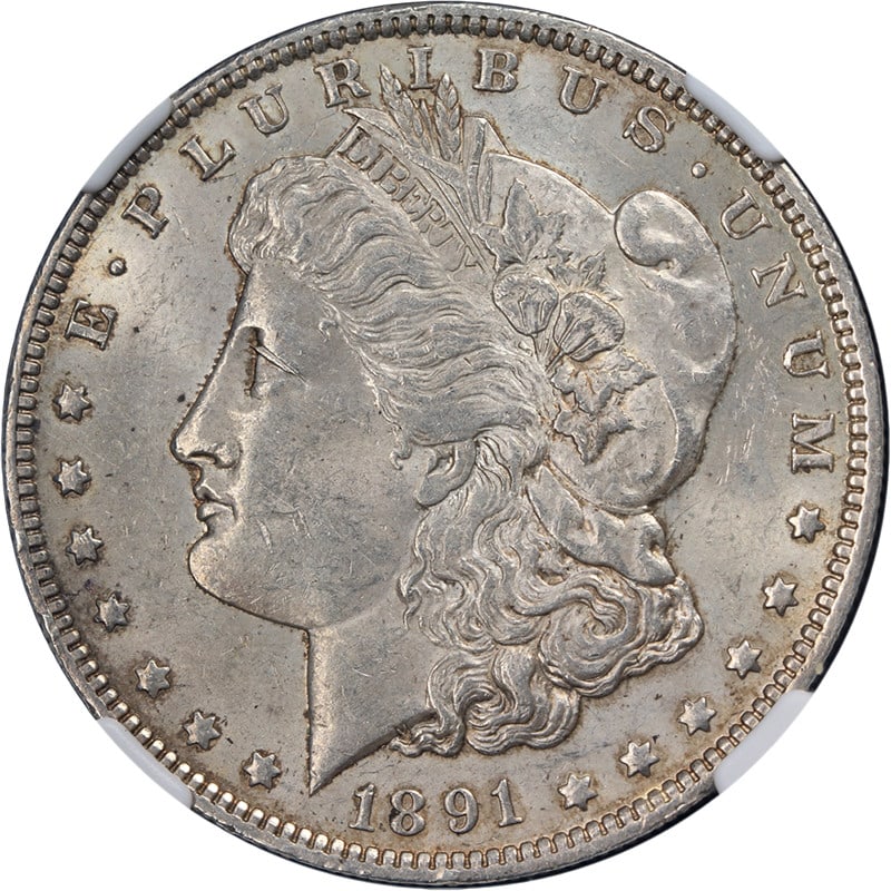 Uncirculated 1891-O Silver Dollar Graded MS61 by NGC: Uncirculated 1891-O Silver Dollar Graded MS61 by NGC This original and undipped 1891-O Morgan Silver Dollar is graded NGC MS61. It features decent eye appeal with nice color and surfaces, as well as a