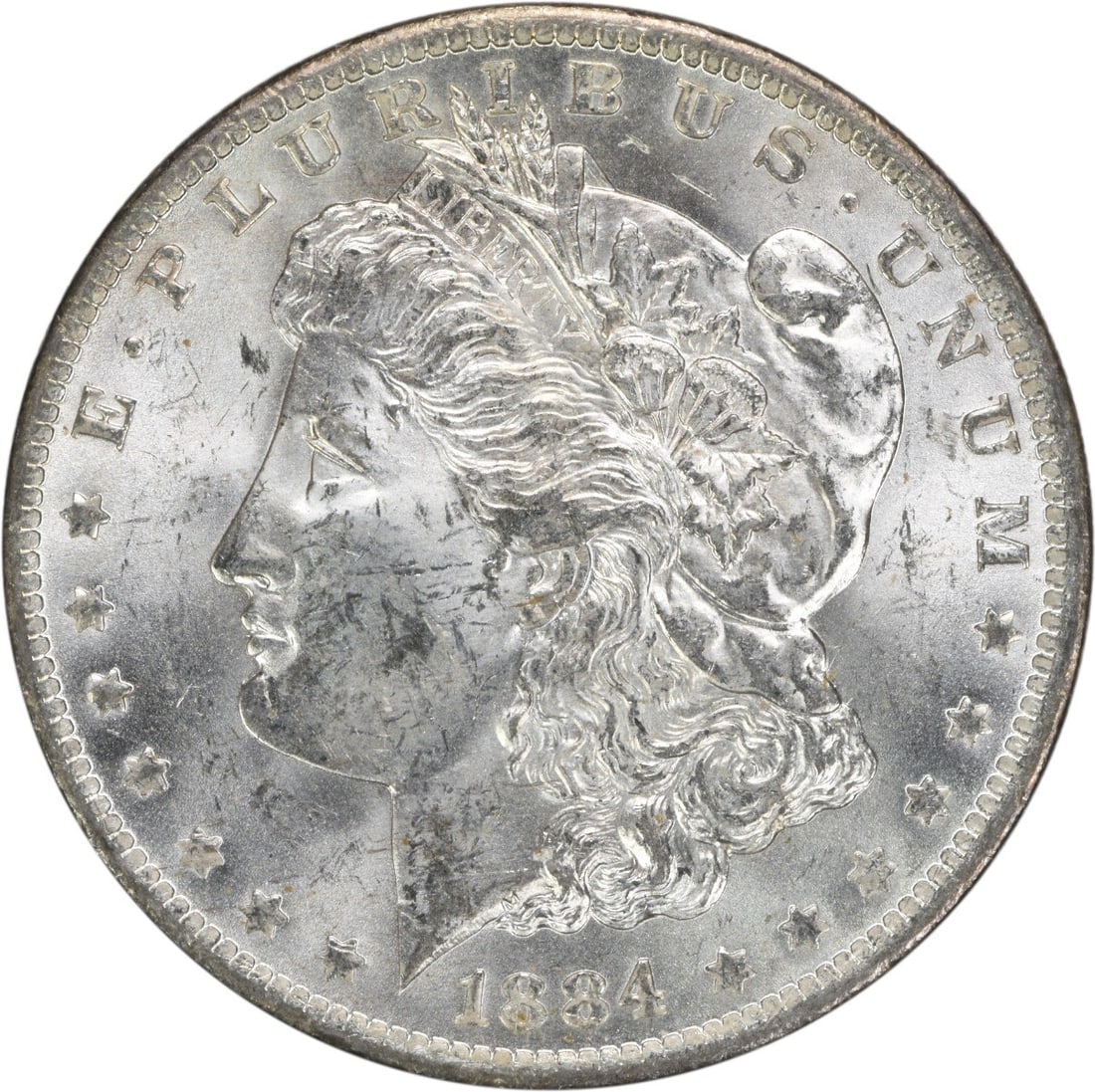 Uncirculated 1884-O Silver Dollar Morgan Type Brilliant Uncertified Example: Uncirculated 1884-O Silver Dollar Morgan Type Brilliant Uncertified Example This is an 1884-O Morgan Silver Dollar from the United States, featuring a Brilliant Uncirculated (BU) grade. The coin is un