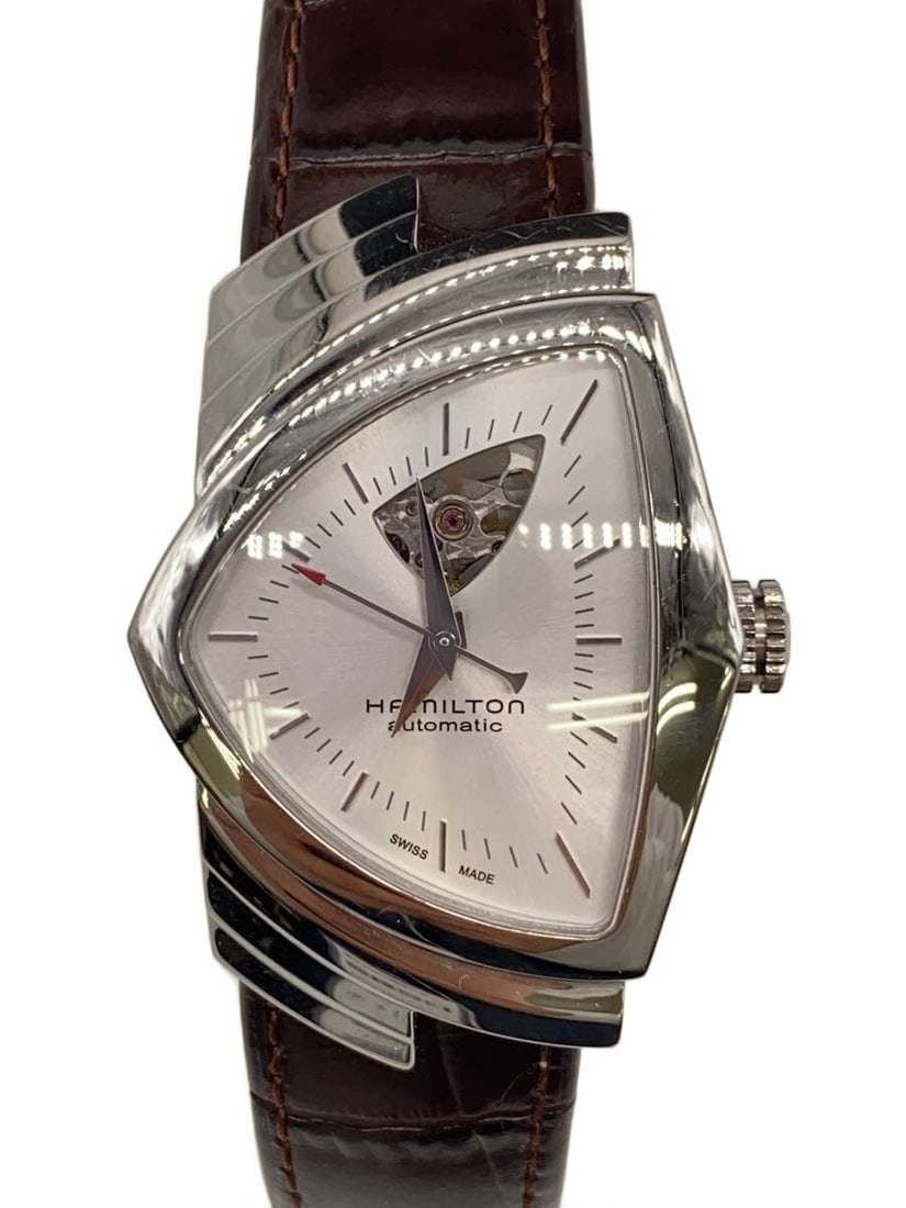 Hamilton Ventura Open Heart Swiss Leather Wristwatch: Hamilton Ventura Open Heart Swiss Leather Wristwatch This is a HAMILTON Ventura Open Heart H245150 men's wristwatch featuring a Swiss-made movement. The watch has a white dial and comes with a leather