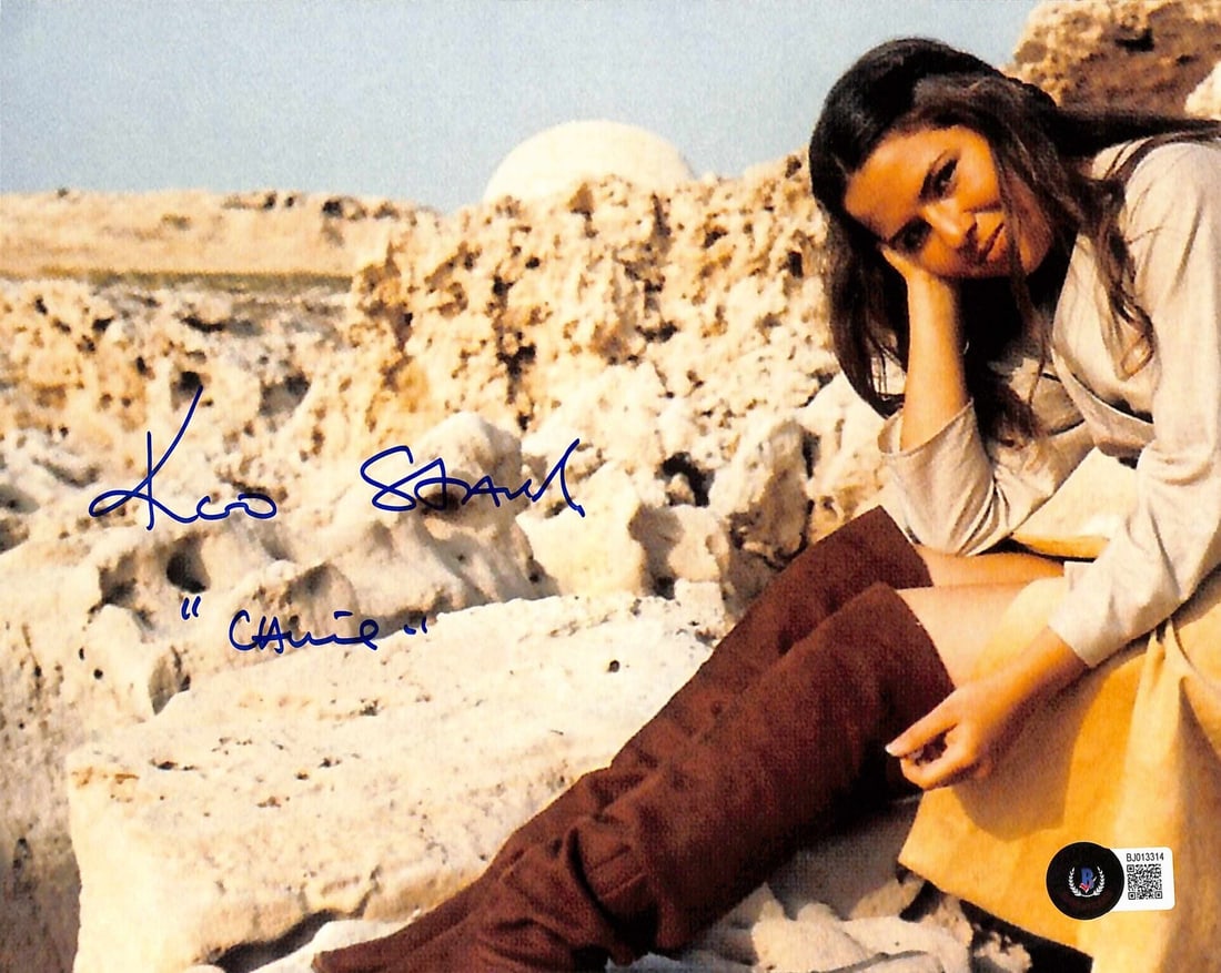 Koo Stark Autographed 11x14 Star Wars Camie Photo Beckett Authenticated: Koo Stark Autographed 11x14 Star Wars Camie Photo Beckett Authenticated This 11x14 color photograph features Koo Stark, who portrayed "Camie" in Star Wars: A New Hope. The photograph is signed by Koo 
