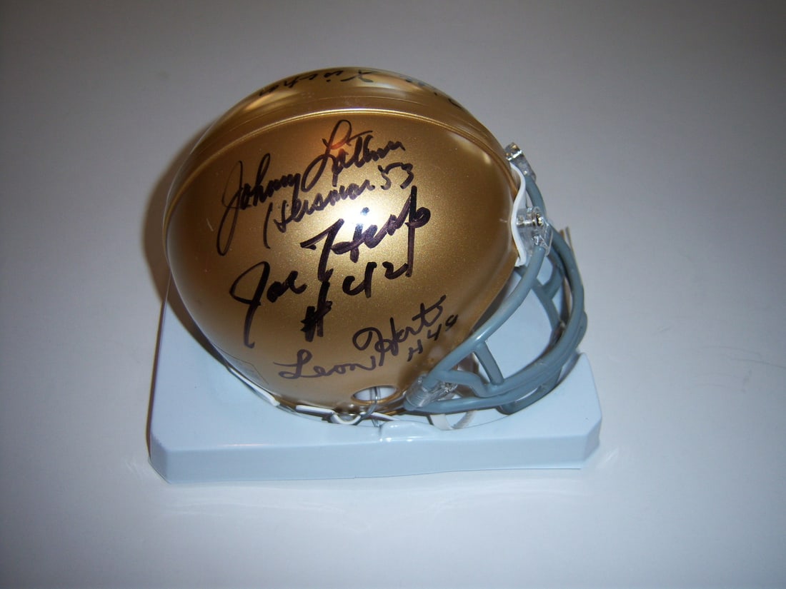 Mini Helmet Signed by Hart Lattner Watters Heap Two Irish With COA: Mini Helmet Signed by Hart Lattner Watters Heap Two Irish With COA This signed mini helmet features autographs from Leon Hart, Johnny Lattner, Ricky Watters, Joe Heap, and two additional Notre Dame Fi