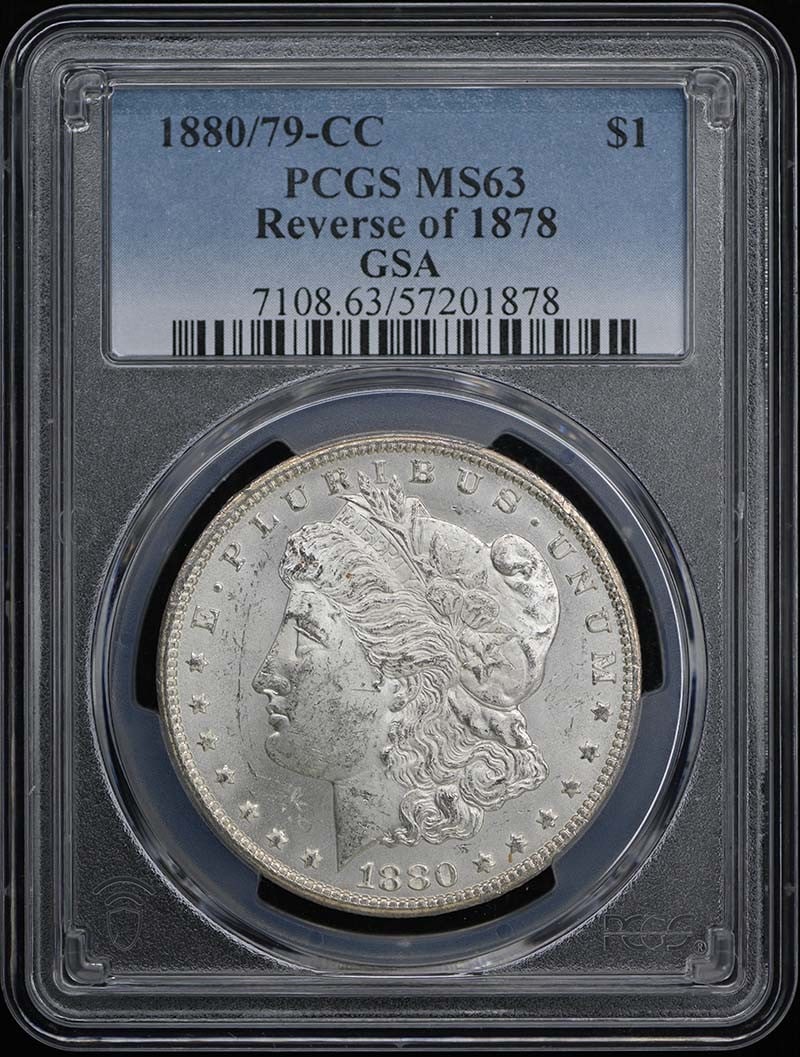 PCGS MS63 1880 79 CC Morgan Dollar Reverse of 1878: PCGS MS63 1880 79 CC Morgan Dollar Reverse of 1878 This is an 1880/79-CC Morgan Dollar featuring the Reverse of 1878. Graded MS63 by PCGS, this uncirculated coin is a pre-owned example from the United