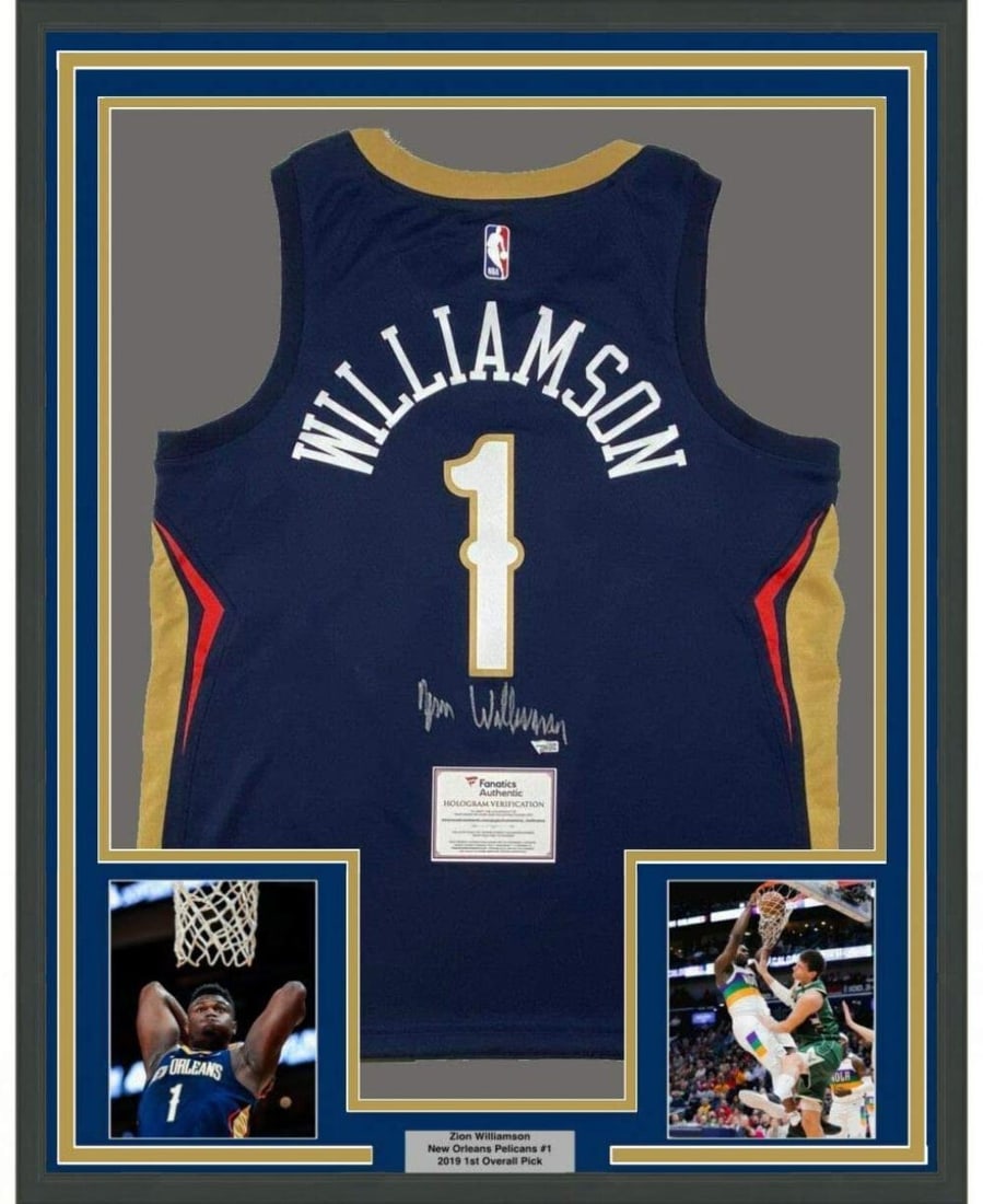 Framed Autographed Zion Williamson Blue Nike Jersey with Fanatics COA: Framed Autographed Zion Williamson Blue Nike Jersey with Fanatics COA This professionally framed and matted jersey features an autographed blue Nike jersey of NBA athlete Zion Williamson, a star playe
