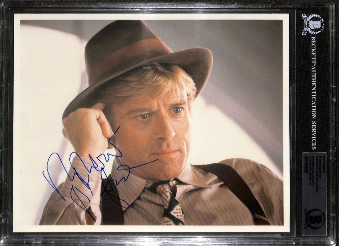 Robert Redford Signed 8x10 Photo The Natural Mint 10 Beckett: Robert Redford Signed 8x10 Photo The Natural Mint 10 Beckett This striking 8x10 color photograph features the iconic Robert Redford, signed in bold blue ink, and encapsulated by Beckett Authentication