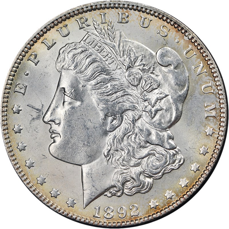 1892 P Morgan Silver Dollar BU+ Uncertified: 1892 P Morgan Silver Dollar BU+ Uncertified This is an original 1892-P Morgan Silver Dollar featuring attractive eye appeal, bright luster, and an average strike. The coin displays great color and sur