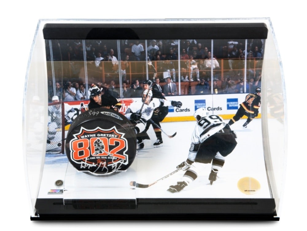 Wayne Gretzky Autographed 802 Goal Puck with 8x10 Photo Limited to 99: Wayne Gretzky Autographed 802 Goal Puck with 8x10 Photo Limited to 99 This collectible features an authentic puck signed by Wayne Gretzky, commemorating his historic 802nd goal. Accompanied by an 8X10
