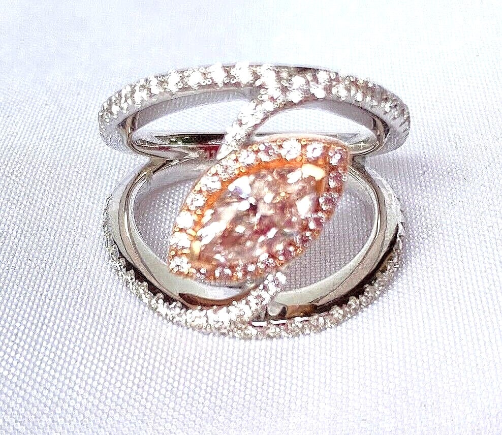 Stunning 0.83 CT Pink Diamond Ring in 14K Rose and White Gold Size 7: Stunning 0.83 CT Pink Diamond Ring in 14K Rose and White Gold Size 7 This exquisite ring showcases a stunning 0.83 ct pink diamond, beautifully set in a combination of 14K rose and white gold. The rin