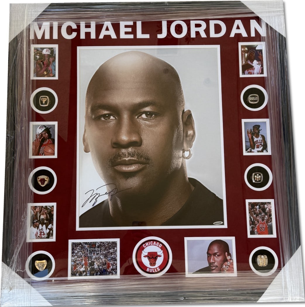 Michael Jordan Autographed Bulls Photo Custom Framed UDA Authenticated: Michael Jordan Autographed Bulls Photo Custom Framed UDA Authenticated This is an original autographed photo of Michael Jordan, a legendary player of the Chicago Bulls. The photo is custom framed and 