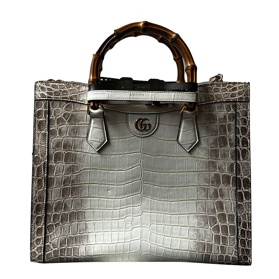 Gucci Bamboo Diana crocodile handbag with bamboo handle: Gucci Bamboo Diana crocodile handbag with bamboo handle This Gucci Diana Bamboo Himalayan handbag is crafted from luxurious crocodile leather in an elegant white shade. It features a signature bamboo 