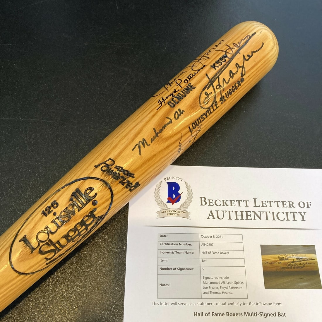 Muhammad Ali Joe Frazier Multi-Signed Baseball Bat with Beckett COA 36": Muhammad Ali Joe Frazier Multi-Signed Baseball Bat with Beckett COA 36" Celebrate boxing history with this remarkable 1980's multi-signed baseball bat featuring legends Muhammad Ali and Joe Frazier, a