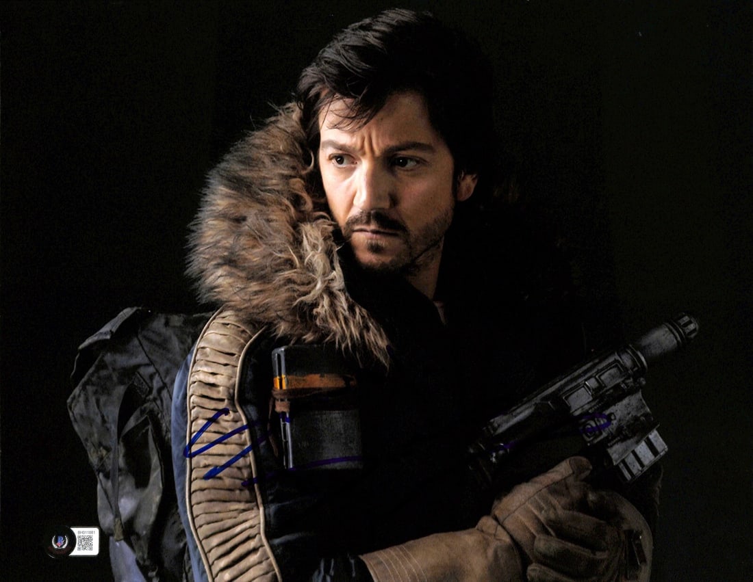 Diego Luna Signed 11x14 Cassian Andor Photo Beckett Authenticated: Diego Luna Signed 11x14 Cassian Andor Photo Beckett Authenticated This stunning 11x14 photograph features Diego Luna as Cassian Andor from 'Rogue One: A Star Wars Story', personally signed in blue per
