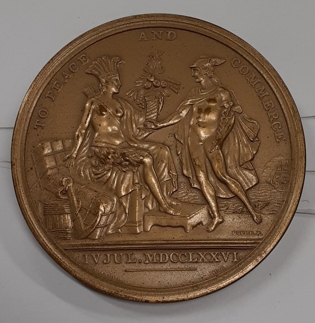 67MM Bronze Peace and Commerce Medal Struck by U.S. Mint: 67MM Bronze Peace and Commerce Medal Struck by U.S. Mint This 67mm bronze medal commemorates Peace and Commerce in the United States. Struck by the U.S. Mint, the medal is un-used but shows some light
