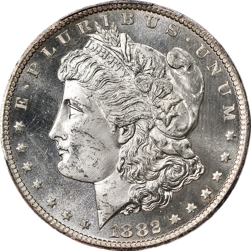 1882-CC Morgan Silver Dollar PCGS MS64 PL Brilliant White Finish: 1882-CC Morgan Silver Dollar PCGS MS64 PL Brilliant White Finish This stunning 1882-CC Morgan Silver Dollar features superb eye appeal, showcasing fantastic luster and a strong strike. The coin is bla