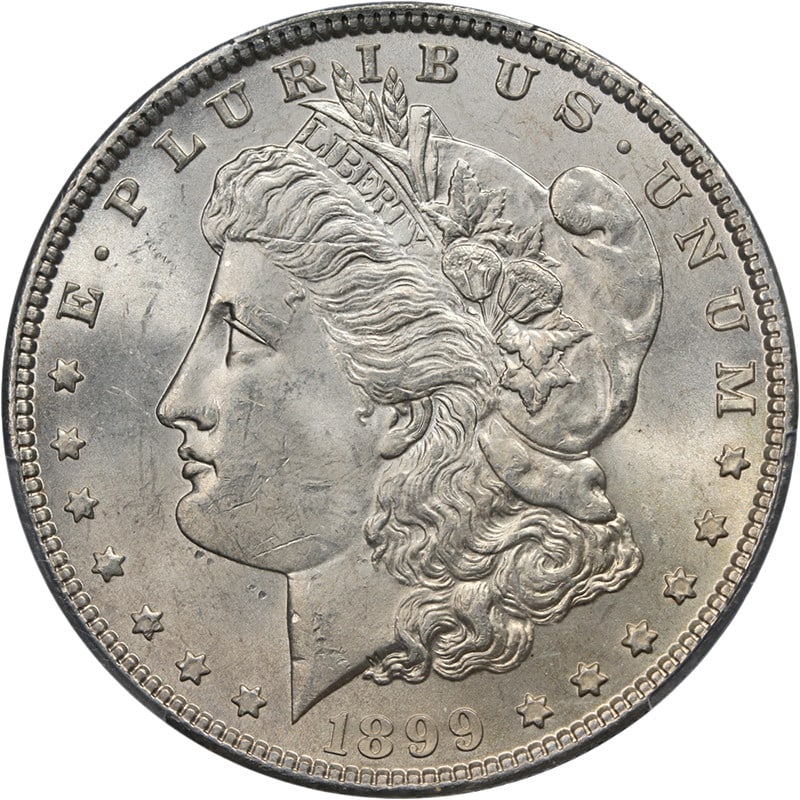 PCGS MS63 1899 P Morgan Silver Dollar: PCGS MS63 1899 P Morgan Silver Dollar This 1899-P Morgan Silver Dollar is graded MS63 by PCGS, indicating an uncirculated coin with attractive luster, strong strike, and mostly white surfaces. The coi