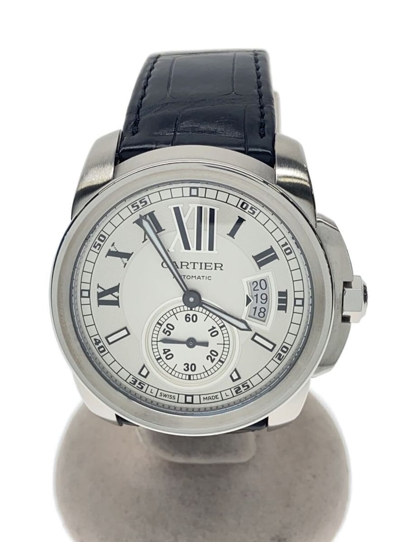 Cartier Calibre de Cartier Leather Strap Wristwatch W7100037: Cartier Calibre de Cartier Leather Strap Wristwatch W7100037 This Cartier Calibre de Cartier W7100037 men's wristwatch features a white dial and a leather strap. It is a pre-owned timepiece with sligh