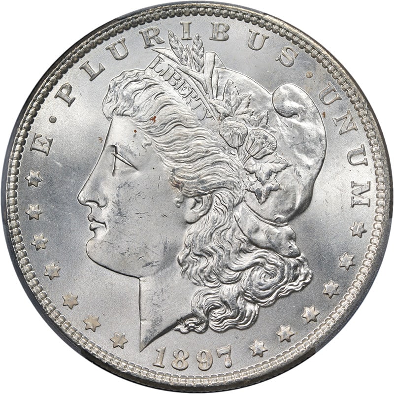 1897 P Morgan Dollar PCGS MS64 Blazing White Strong Strike: 1897 P Morgan Dollar PCGS MS64 Blazing White Strong Strike This 1897-P Morgan Silver Dollar is graded PCGS MS64 and features a pitted reverse with a blazing white appearance. It offers superb eye appe
