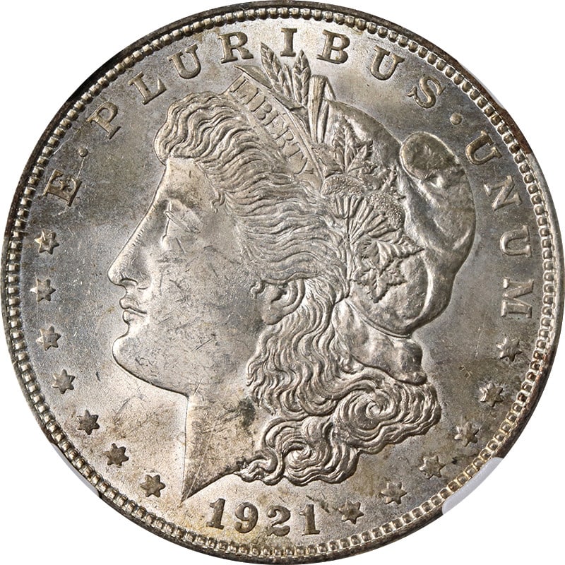 NGC MS63 1921 Philadelphia Morgan Dollar with Light Toning: NGC MS63 1921 Philadelphia Morgan Dollar with Light Toning This 1921-P Morgan Silver Dollar is certified by NGC with a grade of MS63, indicating it is in uncirculated condition. The coin features ligh