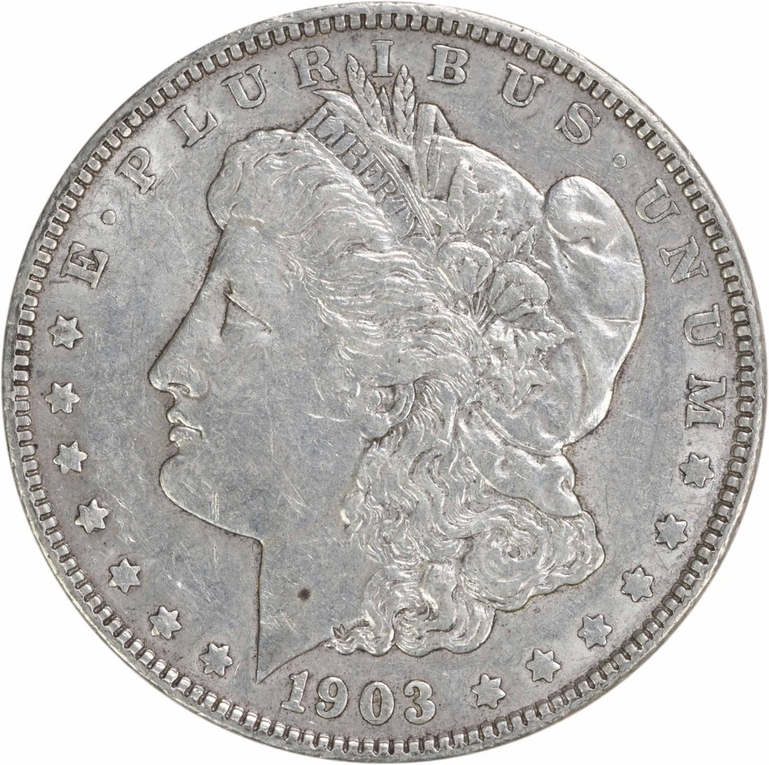 1903 Morgan Silver Dollar AU Uncertified 90% Silver Coin: 1903 Morgan Silver Dollar AU Uncertified 90% Silver Coin This 1903 Morgan Silver Dollar is an exquisite piece featuring a high level of detail in the AU (About Uncirculated) grade. Struck in Philadelp