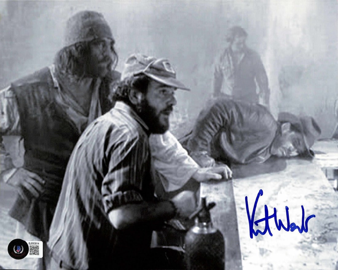 Indiana Jones 8x10 Signed Photo by Kit West Beckett Authenticated: Indiana Jones 8x10 Signed Photo by Kit West Beckett Authenticated This rare 8x10 black-and-white photograph captures Kit West on the set of the iconic Marion's Bar sequence from Indiana Jones and the 