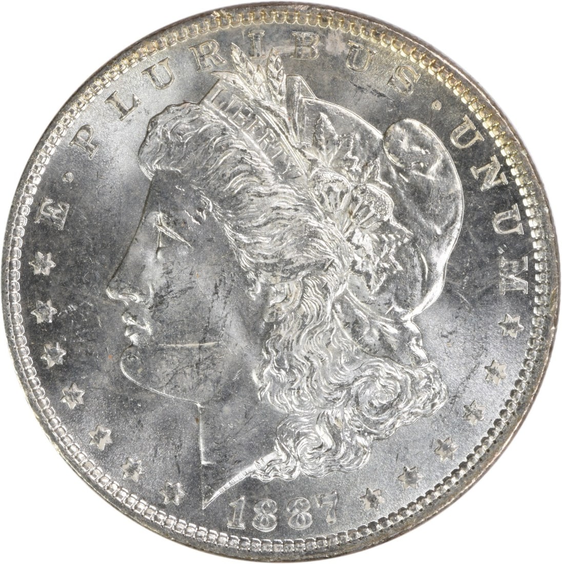 1887 Uncirculated Morgan Silver Dollar Brilliant Uncertified US Coin: 1887 Uncirculated Morgan Silver Dollar Brilliant Uncertified US Coin This is an uncirculated 1887 Morgan Silver Dollar from the United States. The coin is in Brilliant Uncirculated (BU) condition and 