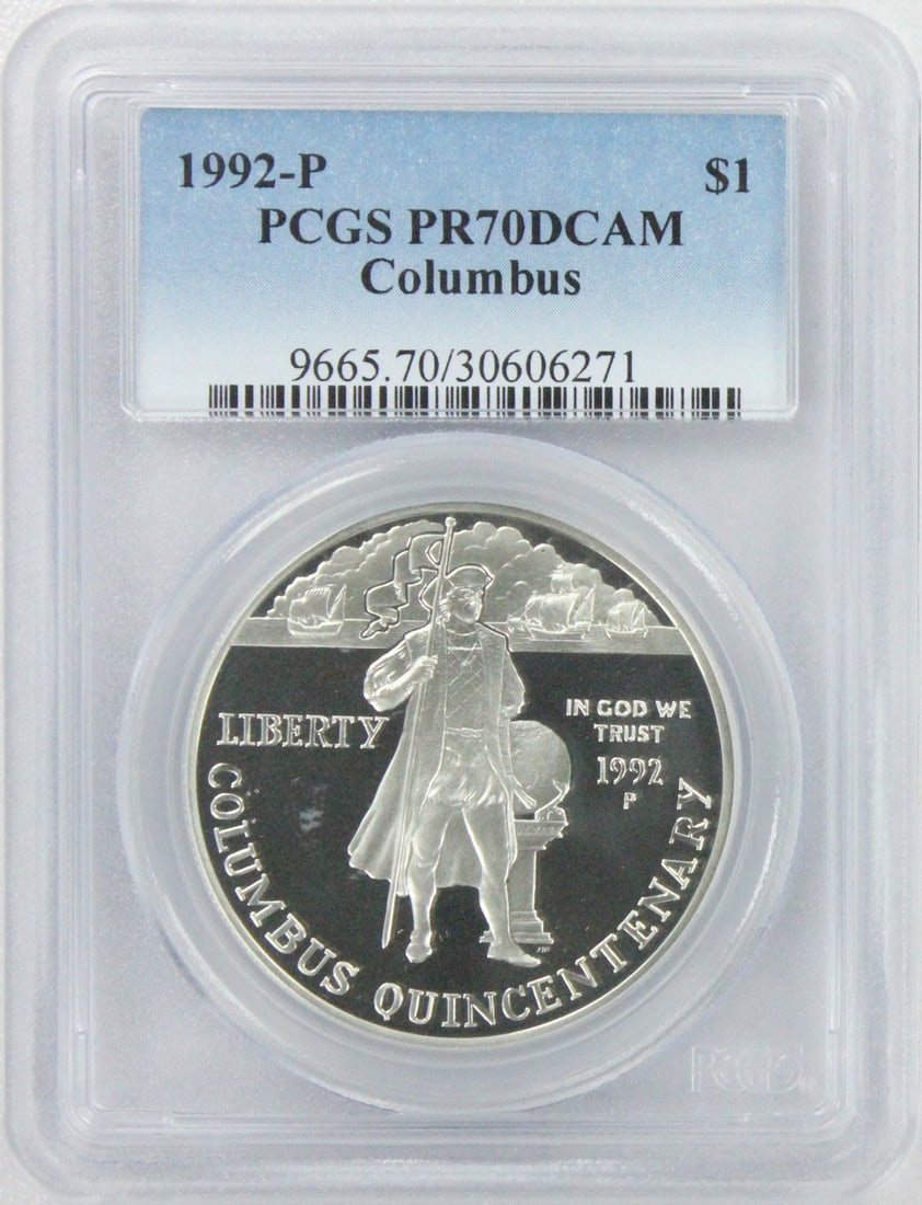 PCGS PR70DCAM Columbus 1992-P Silver Commemorative Dollar: PCGS PR70DCAM Columbus 1992-P Silver Commemorative Dollar This 1992-P Columbus Silver Commemorative Dollar is a proof coin struck at the Philadelphia Mint. Graded PR70 Deep Cameo by PCGS, it represent