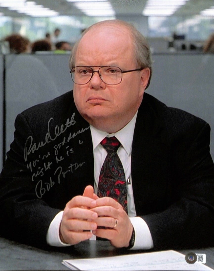 Paul Wilson Signed 11x14 Photo Inscribed Bob Porter Beckett Authenticated: Paul Wilson Signed 11x14 Photo Inscribed Bob Porter Beckett Authenticated This striking 11x14 photograph features Paul Wilson as "Bob Porter" from the iconic film Office Space. The photo is signed in 