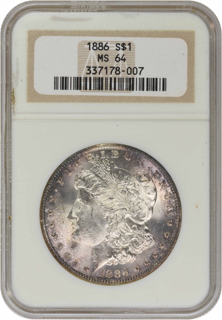 1886 MS64 Morgan Dollar Certified by NGC with Toning: 1886 MS64 Morgan Dollar Certified by NGC with Toning This 1886 Morgan Silver Dollar is certified by NGC and graded MS64. Struck at the Philadelphia Mint with no mint mark, the coin features a composit