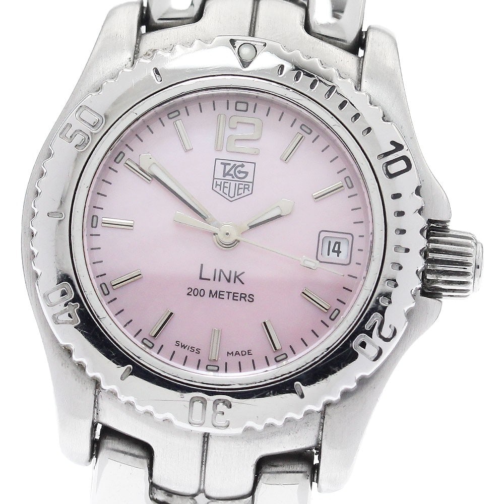 TAG Heuer Link Pink Shell Quartz Date Women's Wristwatch: TAG Heuer Link Pink Shell Quartz Date Women's Wristwatch This TAG HEUER Link WT141M women's wristwatch features a stainless steel case and band with a pink shell dial. The watch is powered by a quartz