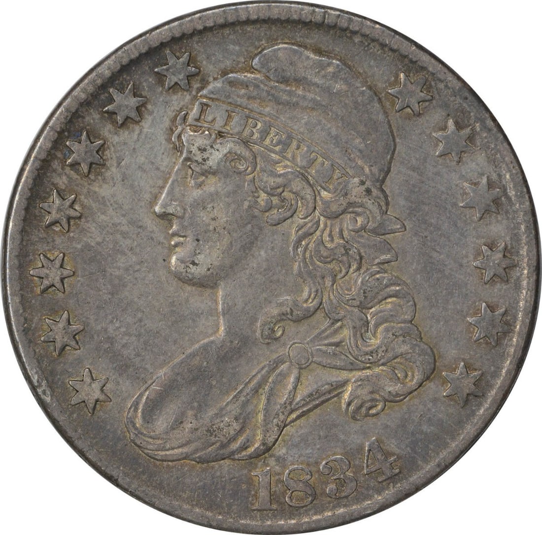 1834 Bust Half Dollar Large Date Small Letters Silver Coin: 1834 Bust Half Dollar Large Date Small Letters Silver Coin This 1834 Bust Half Dollar features a large date with small letters, showcasing the artistry of designer John Reich. It was minted in Philade
