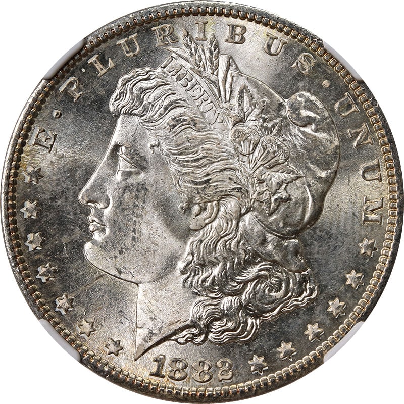 NGC MS65 1882-S Morgan Dollar with Colorful Toning: NGC MS65 1882-S Morgan Dollar with Colorful Toning This 1882-S Morgan Silver Dollar is certified by NGC with a grade of MS65, indicating an uncirculated condition. The coin features attractive toning 