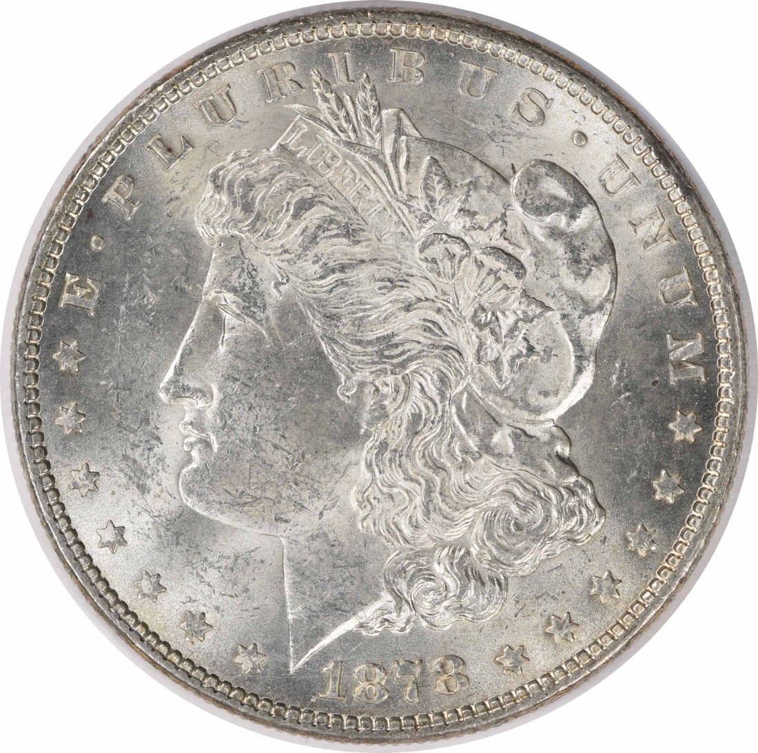 1878 Silver Morgan Dollar Uncirculated 7 Over 8 Tail Feathers BU: 1878 Silver Morgan Dollar Uncirculated 7 Over 8 Tail Feathers BU This 1878 Morgan Silver Dollar features the 7 over 8 Tail Feathers variety and is in Brilliant Uncirculated condition. Composed of silv