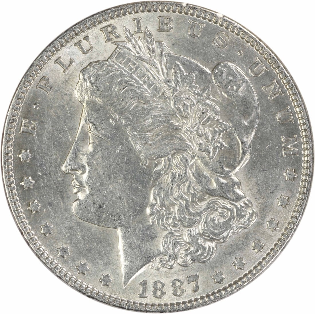 1887 Philadelphia Morgan Dollar AU Uncertified Silver Coin: 1887 Philadelphia Morgan Dollar AU Uncertified Silver Coin This 1887 Morgan Silver Dollar is an attractive example from the Philadelphia Mint, featuring a composition of 90% silver and 10% copper. Des