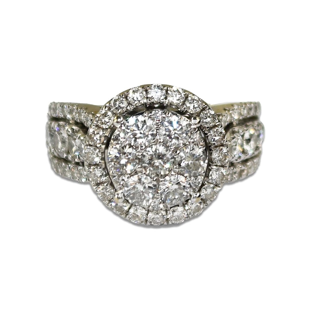 14K White Gold Cluster Diamond Ring Size 5.25: 14K White Gold Cluster Diamond Ring Size 5.25 This pre-owned cluster ring features natural round brilliant diamonds set in 14K white gold. The ring offers a total carat weight between 1.50 and 1.74 ca