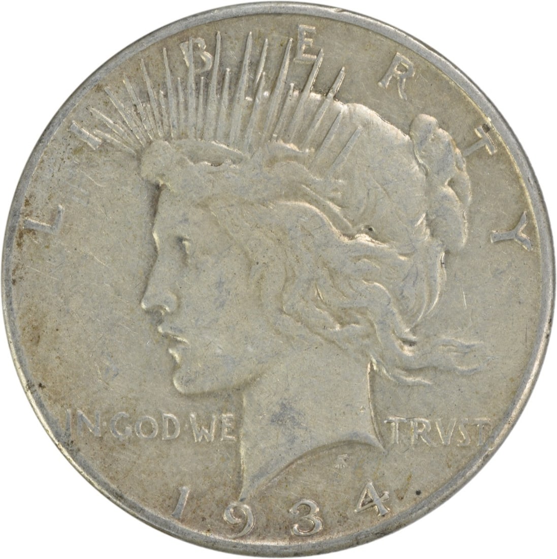 1934-S Peace Silver Dollar VF Uncertified 90% Silver Coin: 1934-S Peace Silver Dollar VF Uncertified 90% Silver Coin This 1934-S Peace Silver Dollar is a beautiful representation of American coinage, featuring the iconic design by Anthony de Francisci. This c