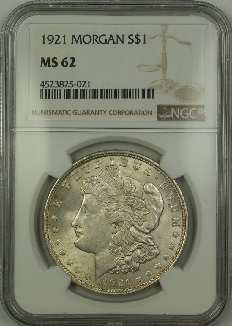 NGC MS 62 1921 Morgan Dollar Silver $1 Coin: NGC MS 62 1921 Morgan Dollar Silver $1 Coin This 1921 Morgan Silver Dollar is an uncirculated $1 coin from the United States, minted in Philadelphia. Graded MS 62 by NGC, this coin is composed of silv