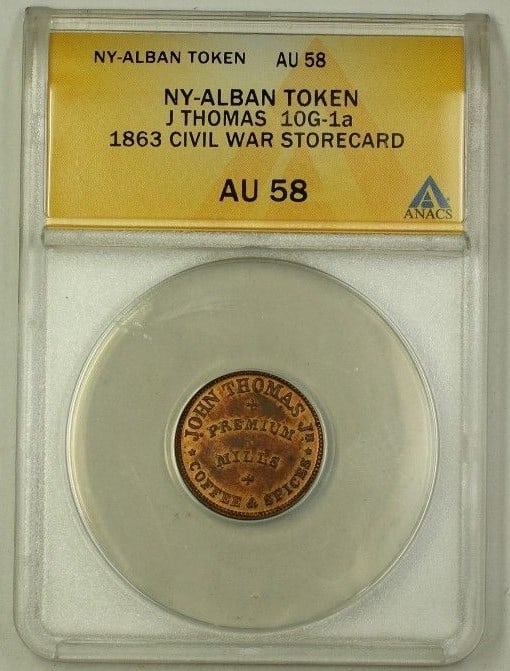 ANACS AU-58 1863 Albany Civil War Storecard Token John Thomas 10G-1a: ANACS AU-58 1863 Albany Civil War Storecard Token John Thomas 10G-1a This is an 1863 Albany, New York Civil War storecard token attributed to John Thomas, catalogued as 10G-1a. The token has been grad