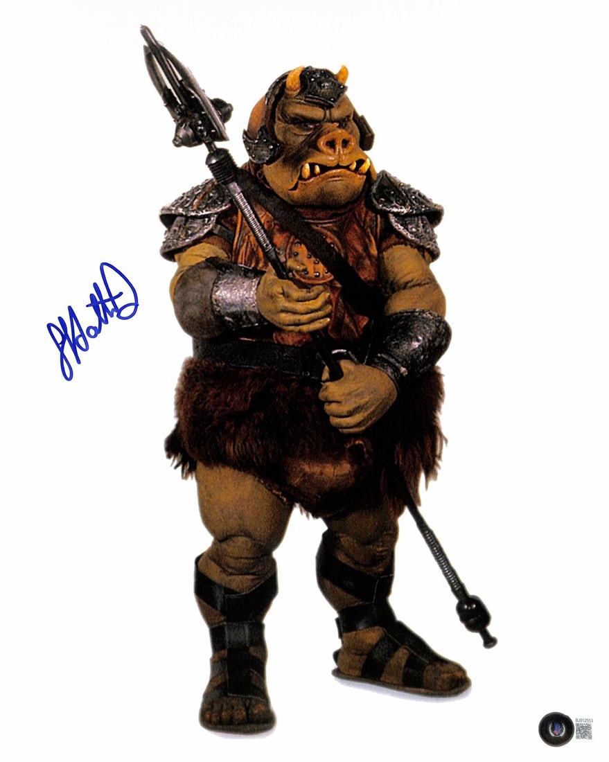 11x14 Autographed Photo Graeme Hattrick as Gamorrean Guard Beckett Certified: 11x14 Autographed Photo Graeme Hattrick as Gamorrean Guard Beckett Certified This 11x14 photograph features a blue permanent marker signature from Graeme Hattrick, who portrayed the Gamorrean Guard in