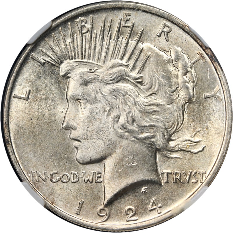 1924 P Peace Silver Dollar NGC MS65: 1924 P Peace Silver Dollar NGC MS65 This 1924-P Peace Dollar is graded MS65 by NGC, indicating an uncirculated coin with strong eye appeal, attractive luster, and a well-defined strike. The coin featu