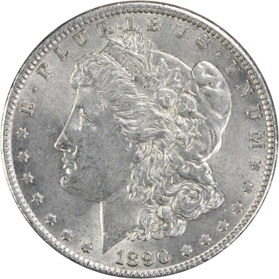 1890 Morgan Silver Dollar AU Uncertified 90% Silver Coin: 1890 Morgan Silver Dollar AU Uncertified 90% Silver Coin This 1890 Morgan Silver Dollar, a renowned piece of American numismatic history, features a striking design by George T. Morgan. The coin is co