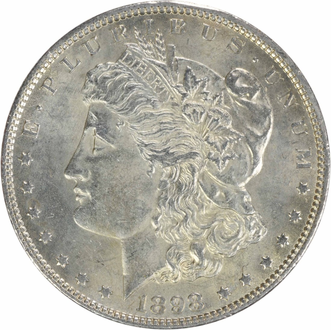 1898 Morgan Silver Dollar AU Uncertified 90% Silver Coin: 1898 Morgan Silver Dollar AU Uncertified 90% Silver Coin This 1898 Morgan Silver Dollar showcases a beautiful design by George T. Morgan, reflecting the rich history of American coinage. This particul